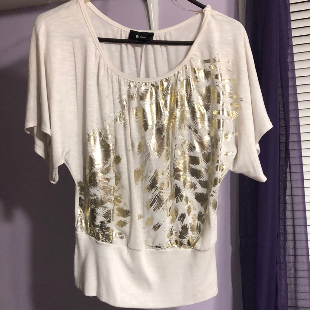 White blouse with gold detail
